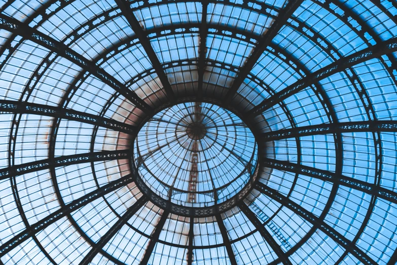 the glass dome in a building has very high ceilings