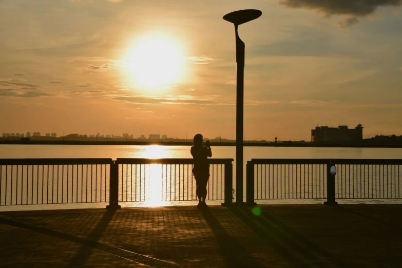 a person that is standing near a light