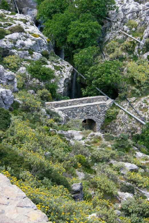 an old stone bridge built into a hillside