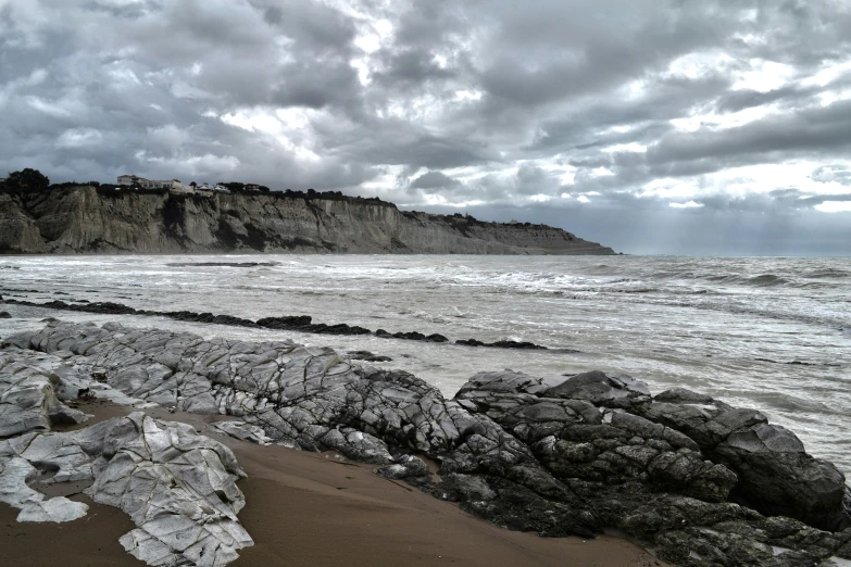 a very big pretty beach with some water