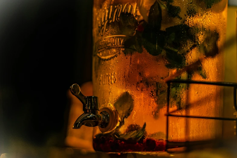 a drink is being poured into a beer bottle