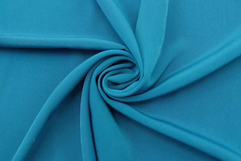 a light blue fabric with the end of it being folded