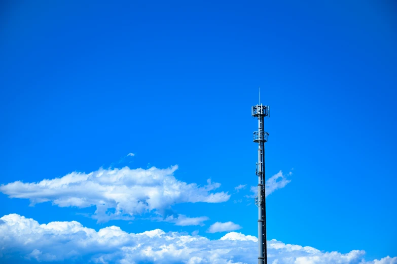 a tall pole with some lights on top of it