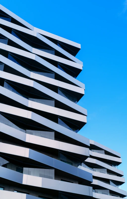 a building that has multiple layers with blue sky