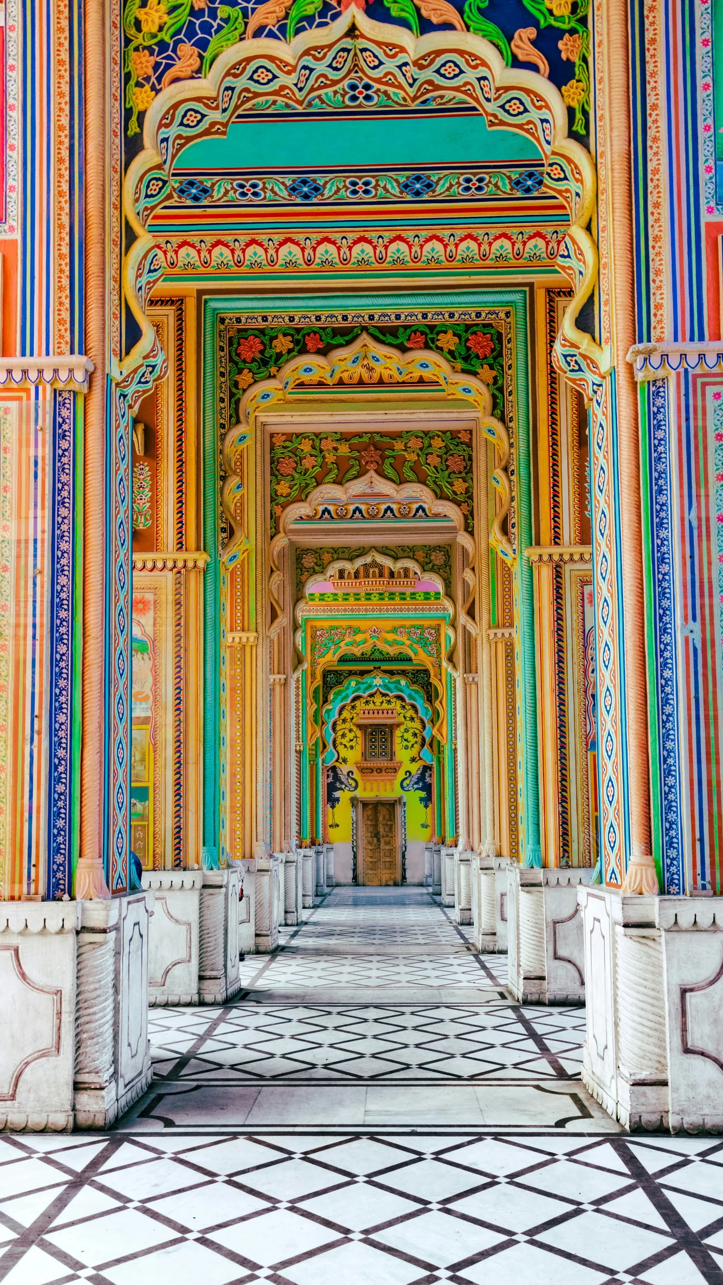 colorfully painted, ornate architecture with ornate pillars