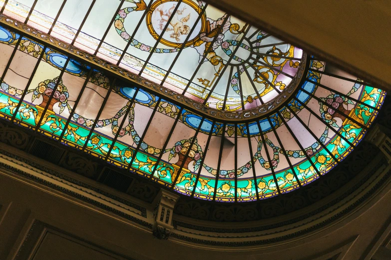 the inside of an ornate glass building