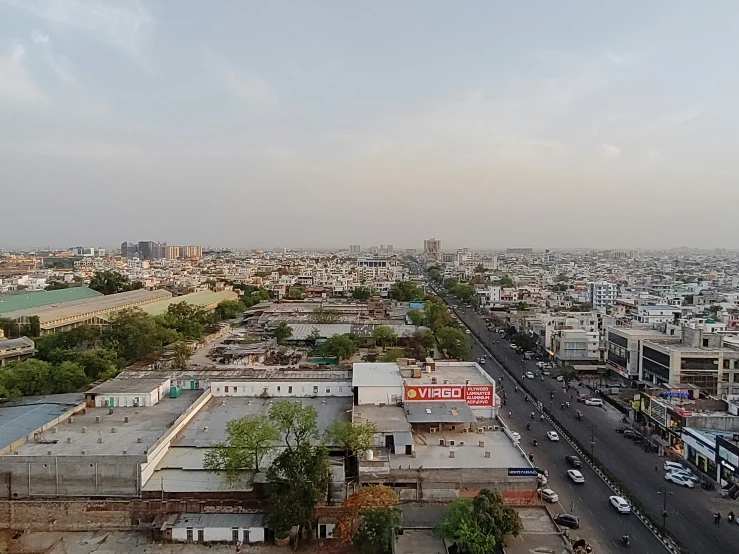 an urban area with street, buildings and cars