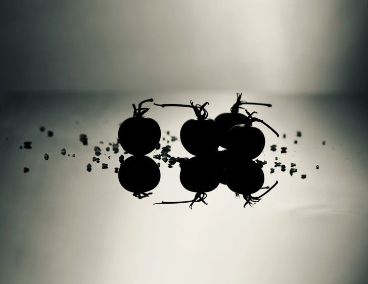 a group of fruits are reflected on water