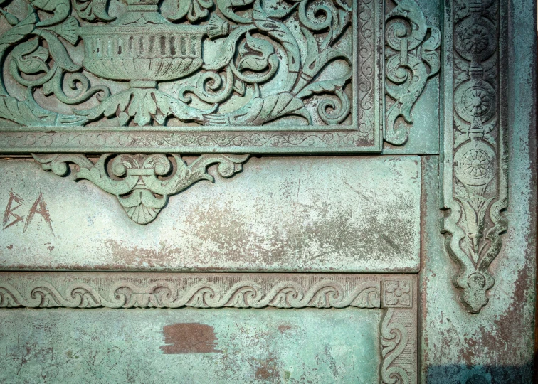 an ornate and stone decoration in the middle of the wall