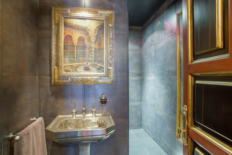 a powder room with antique ss decor and a bathroom sink