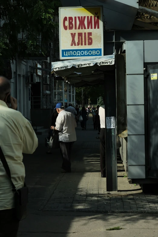 the men are walking in front of the building