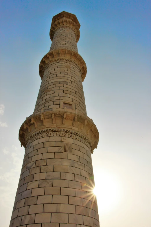 a very tall brick tower towering into the sky