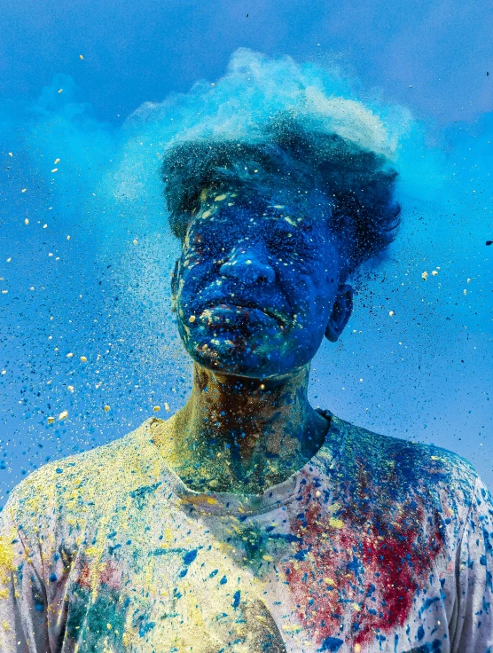 a man covered in blue and orange colors