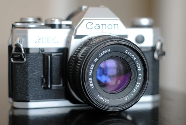 a camera sitting on a desk with its lens up