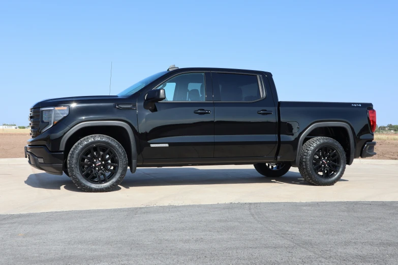 the front end view of a black lifted truck