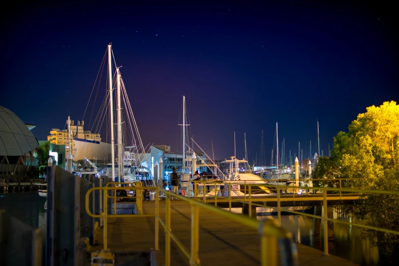 a dock with multiple boats in the water