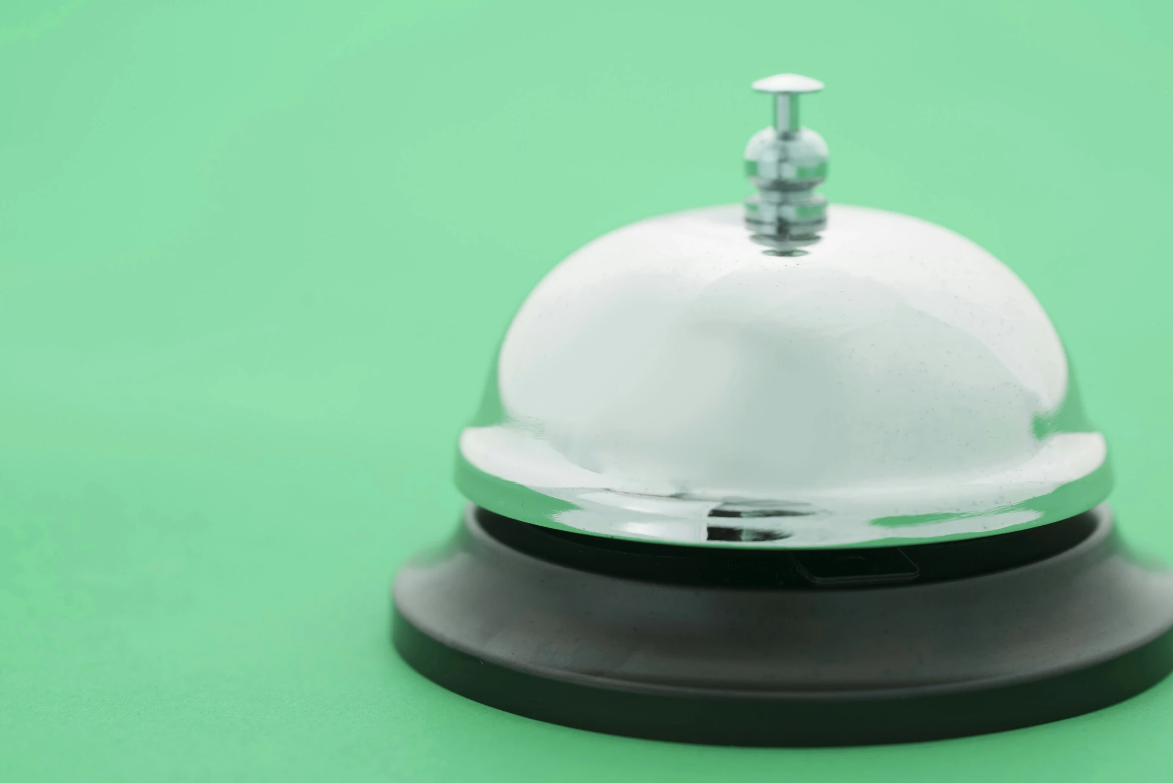 a small dome sits atop a black and white base