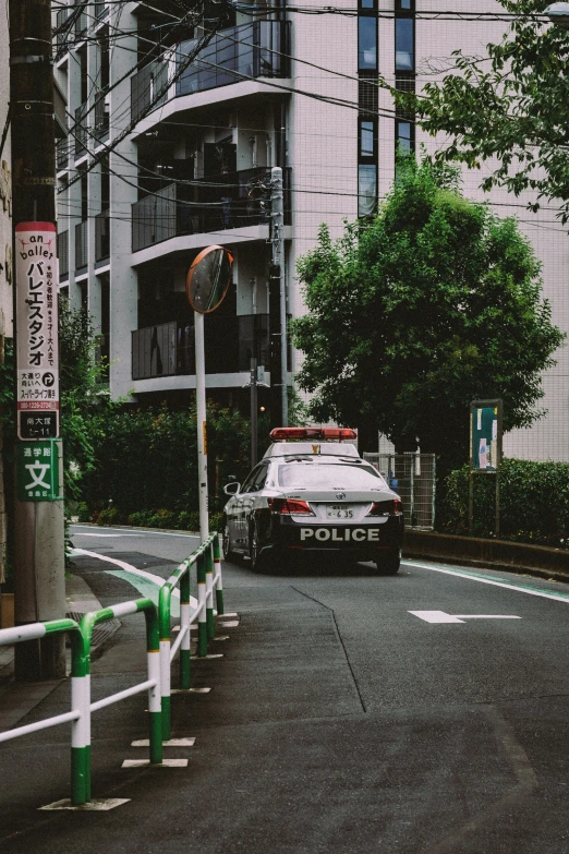 an empty street with police car on it