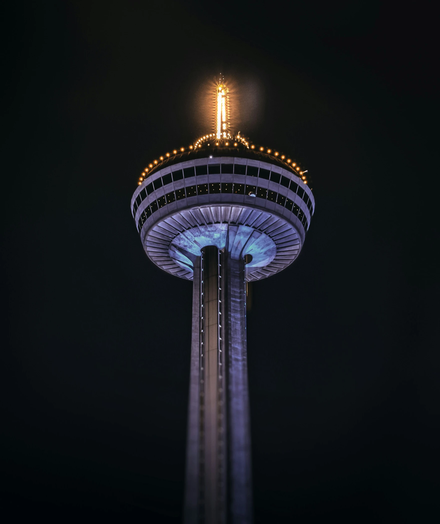 an image of the top of a tower at night