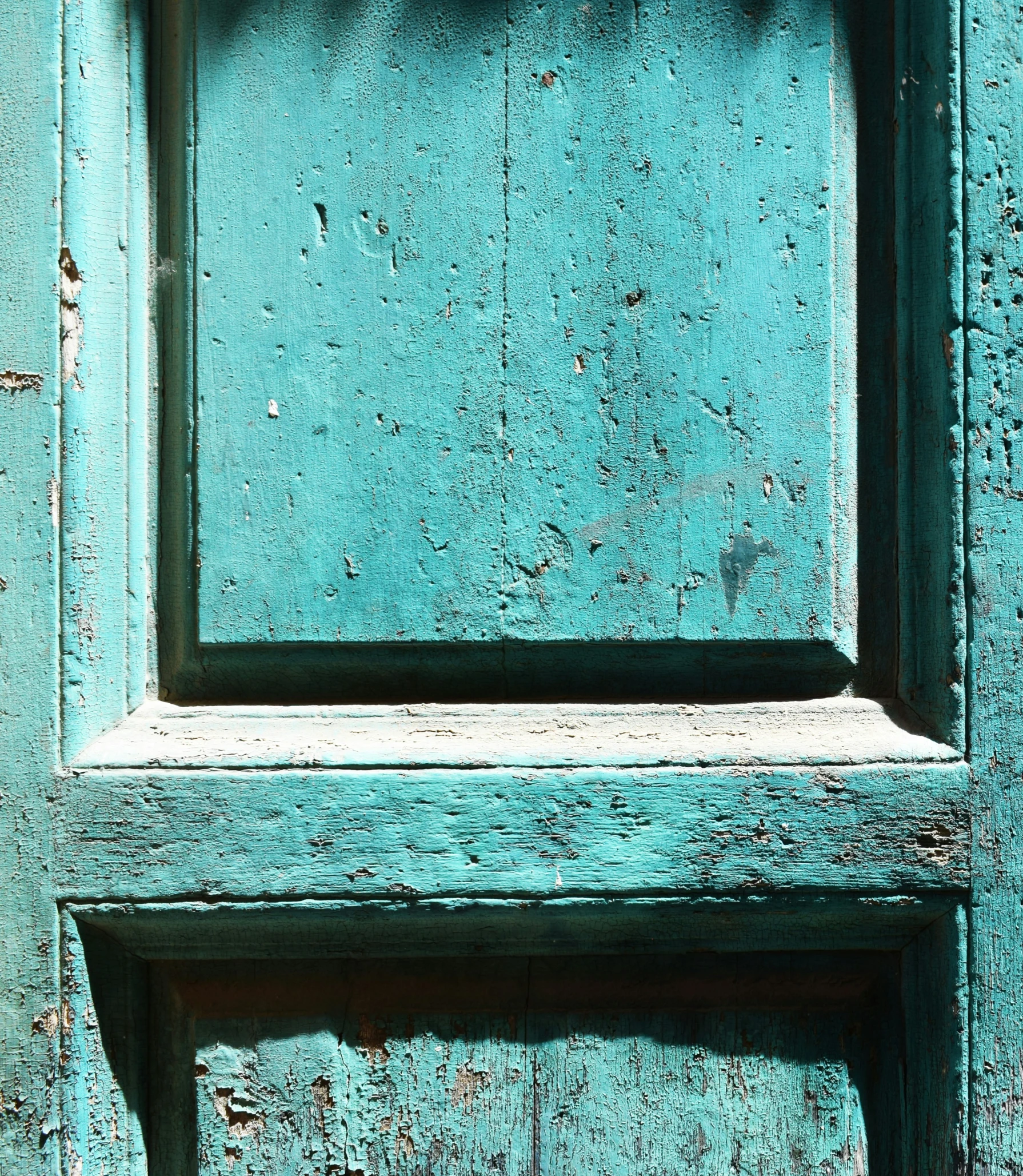 a closeup view of the texture of paint on the inside of a door