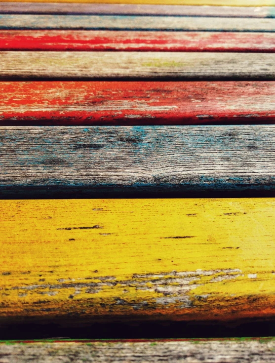 an assortment of colors of wooden slatted pieces