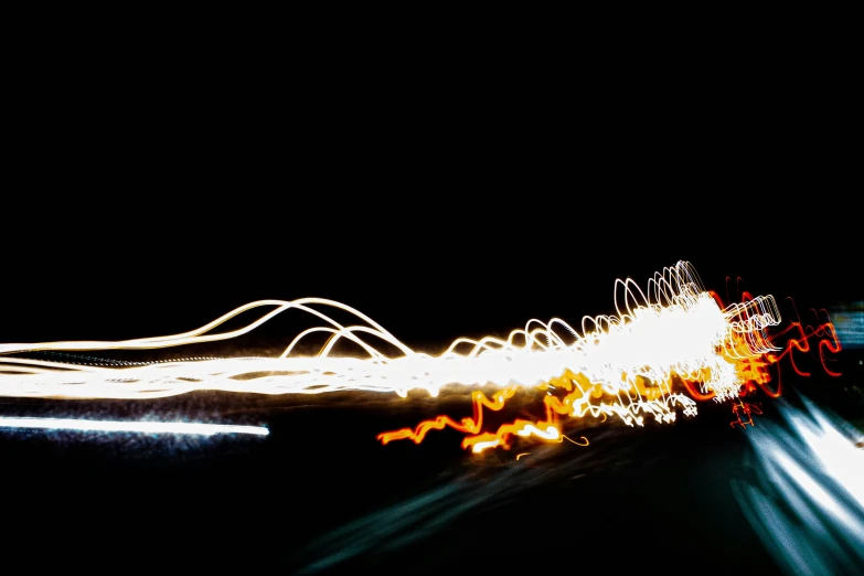 cars drive in the street with blurred lights