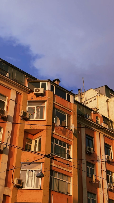 there are many windows in this orange building