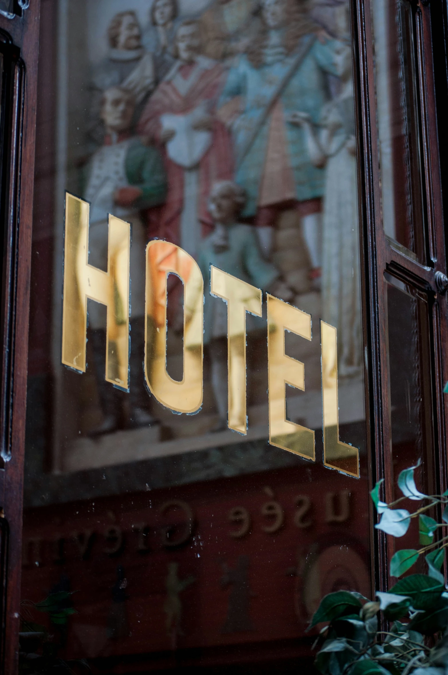 the word el etched into glass in front of a building