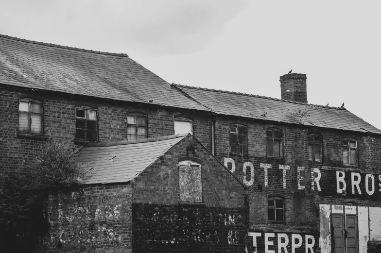 the building in black and white has been boarded down