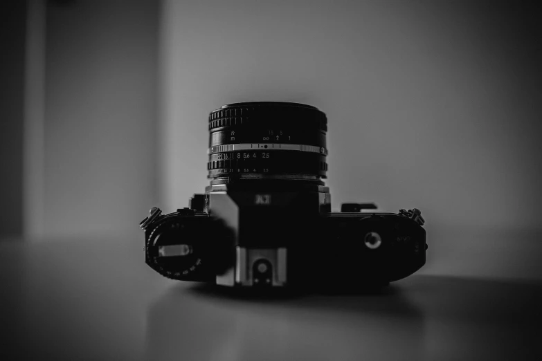 a camera on a table with its lens closed