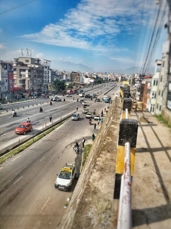 a view from a city bus of cars on the street