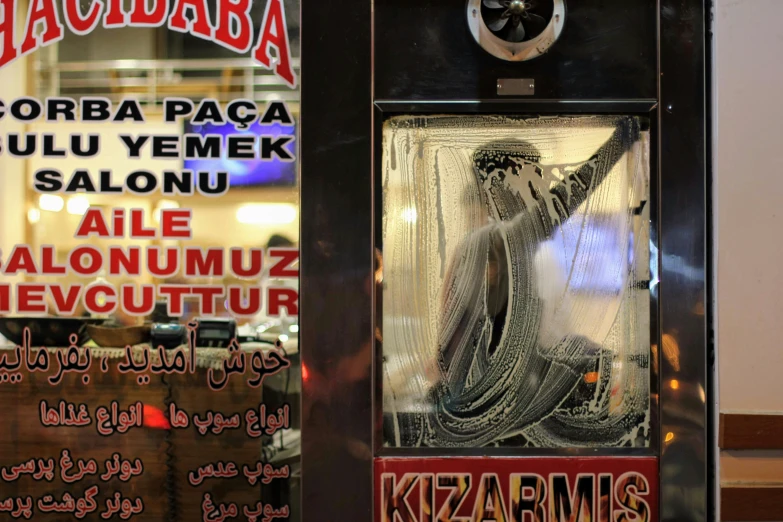 a window display showing a statue in the glass