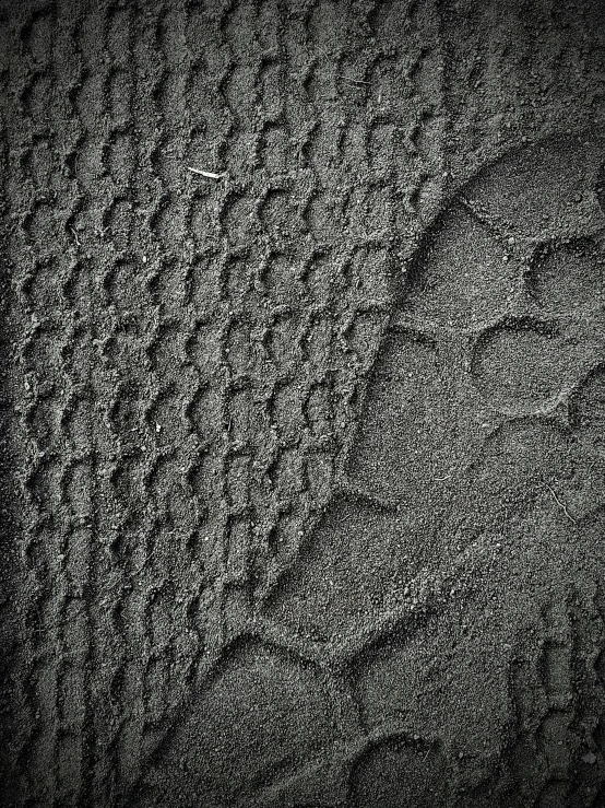 sand and water in the sand at the beach