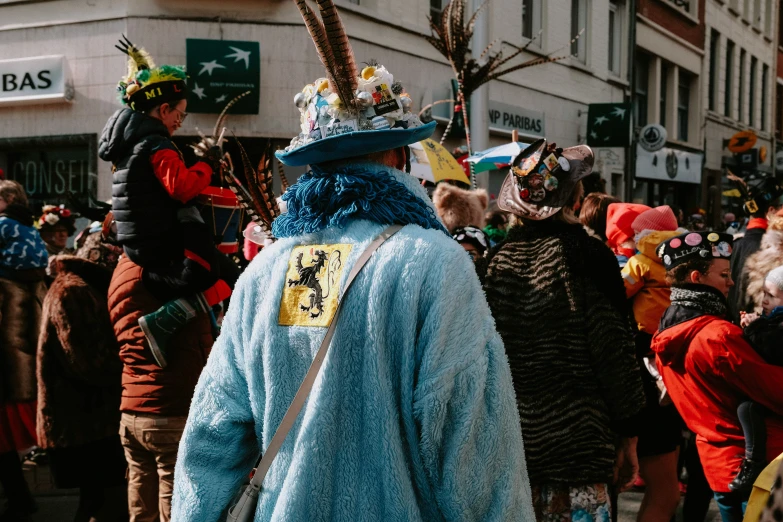 group of people in funny hats, dressed in costumes