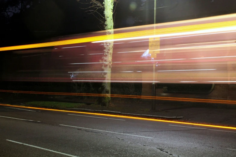 a car going down the street at night