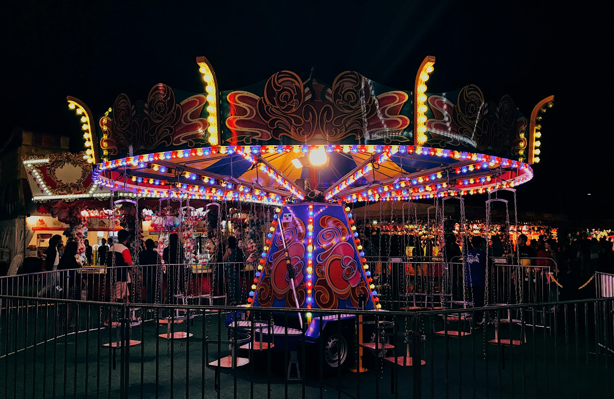 a merry go round lite up at night time