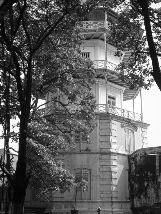 a tall, white building with a clock at the top of it