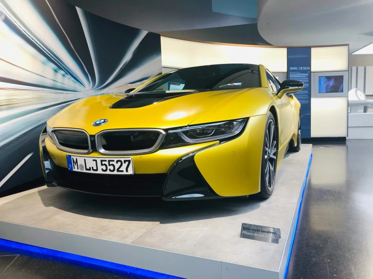 an orange car that is on display at the museum