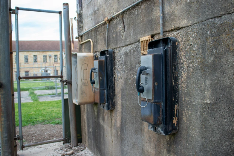 an old phone is on display in a public enclosure