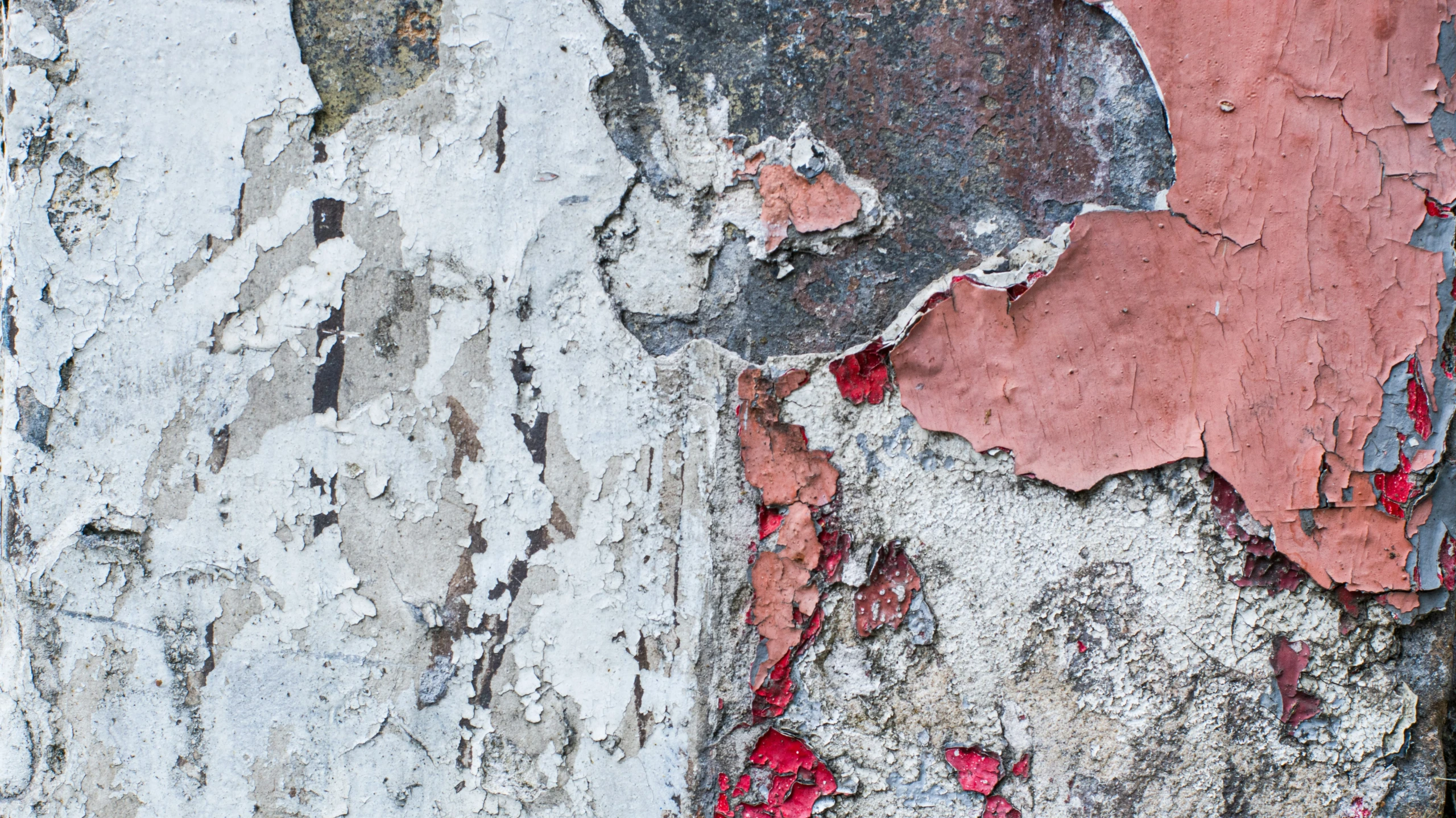 the wall of a building with peeling paint