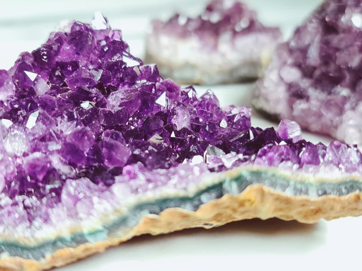 some kind of crystals on a table with other rocks