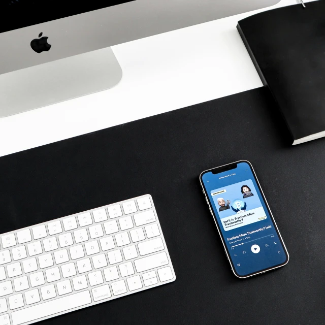 an apple and a keyboard on a desk