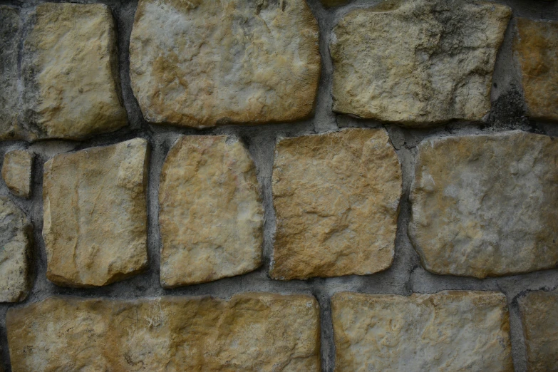 a close up po of a wall made from rocks