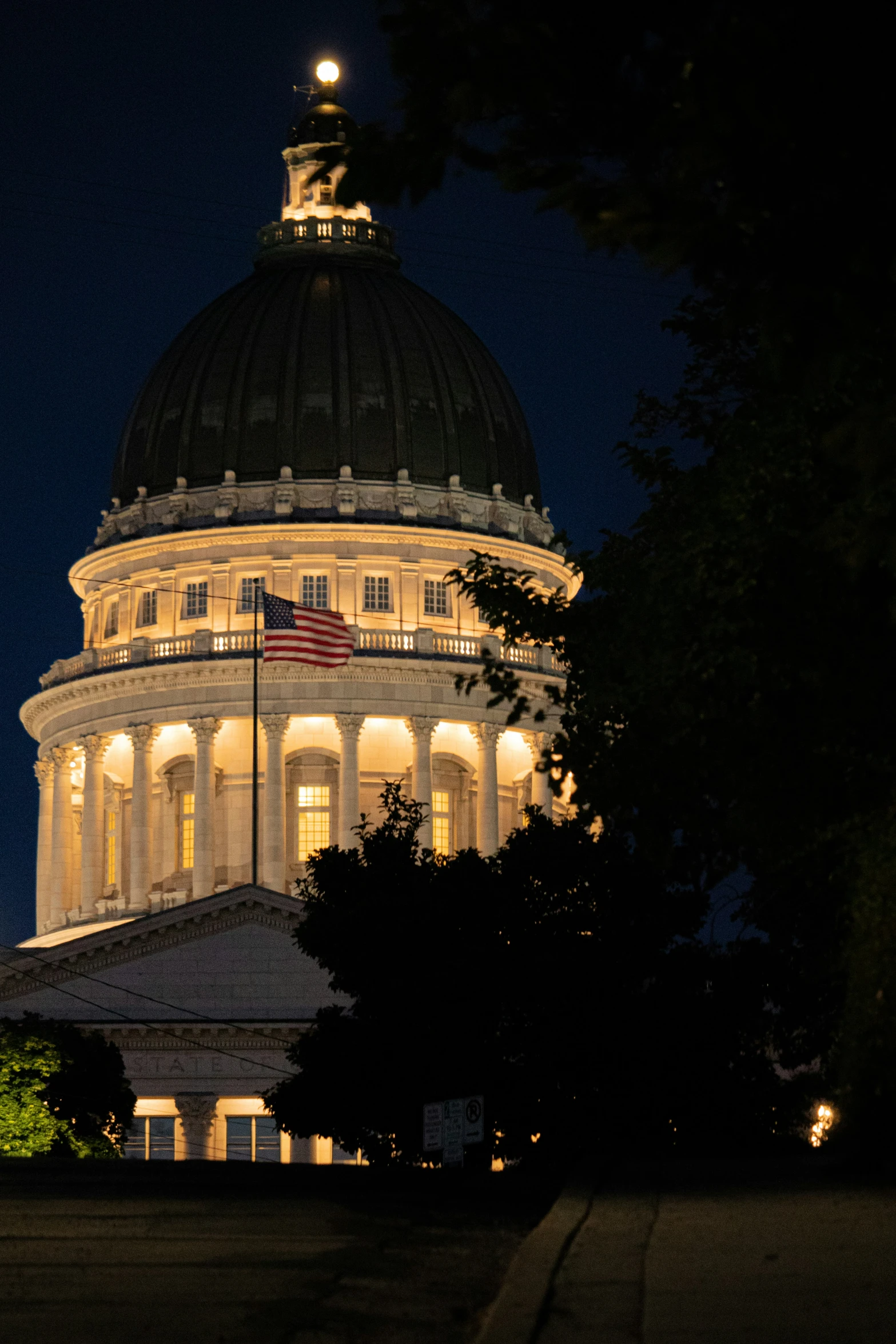 an old style dome lit up at night