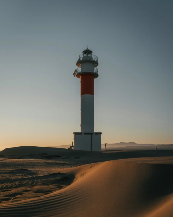 the light tower is on a rocky area