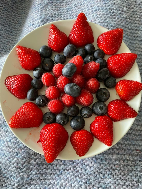 strawberries and blueberries arranged in a spiral form