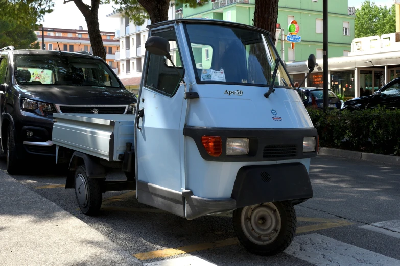 a car that is sitting parked next to another vehicle