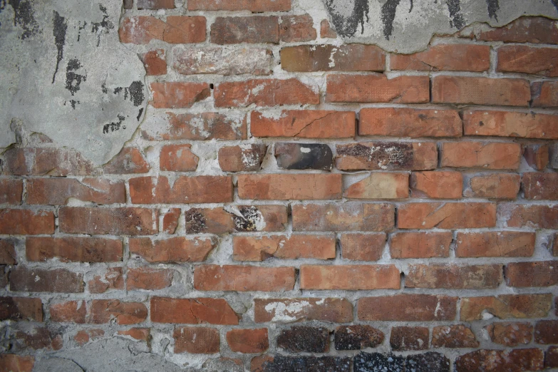 a po of an old brick wall with grungy paint