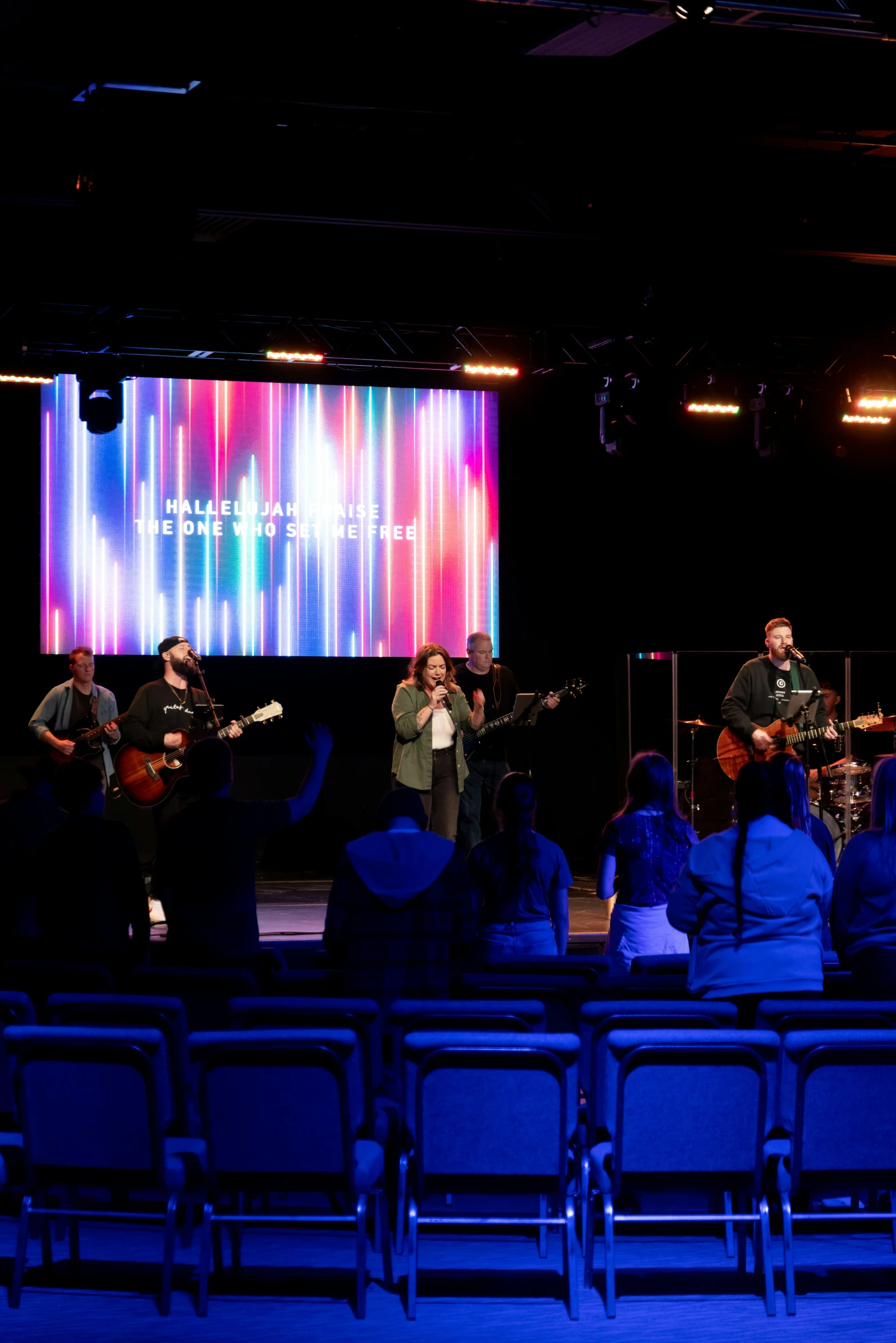 a concert on stage with two male musicians