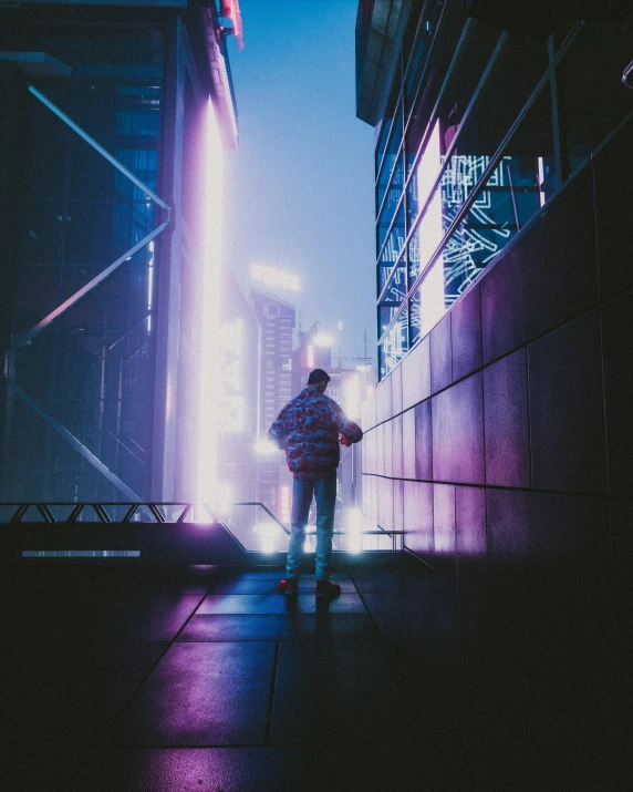 a man walking on the sidewalk in the dark with bright lighting shining on his shirt